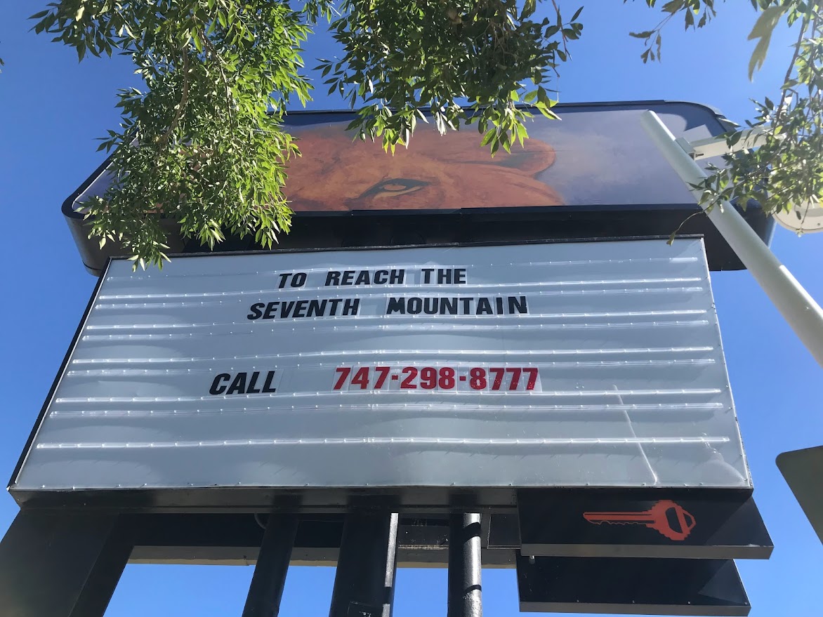To Reach the Seventh Mountain sign in Albuquerque, NM art work